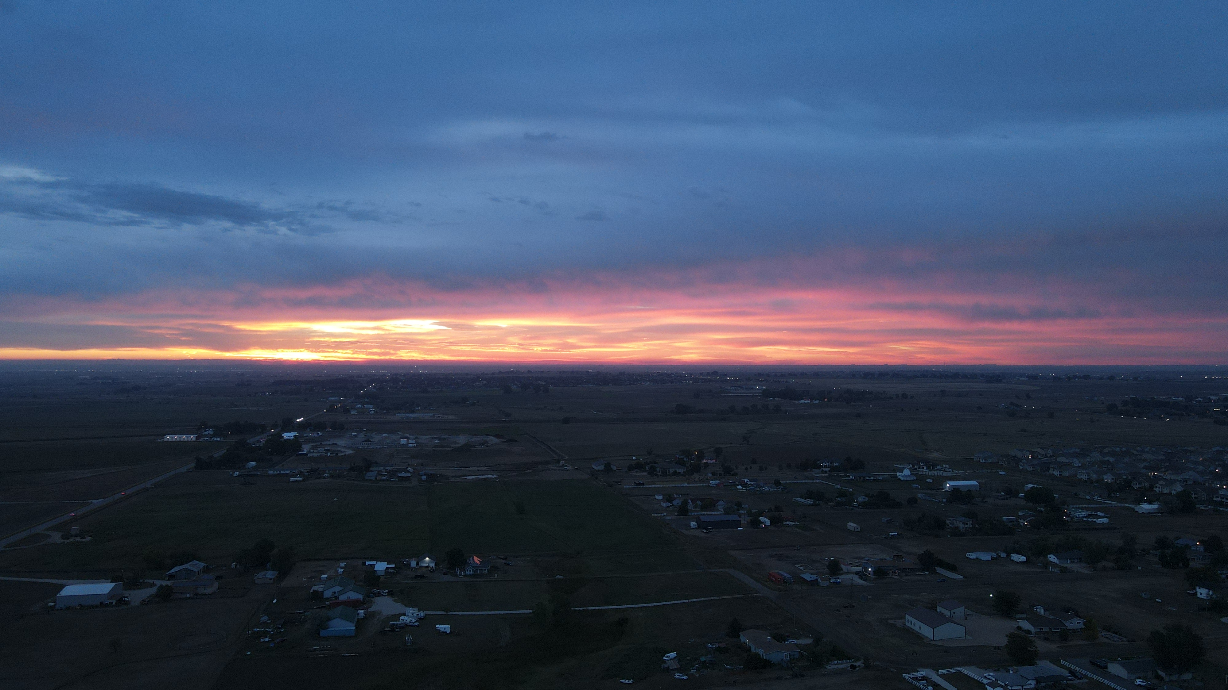 Sunrise between the ground and clouds
